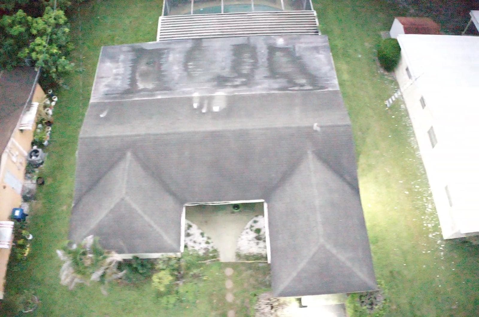 Drone photo of a shingle roof with algae streaks
