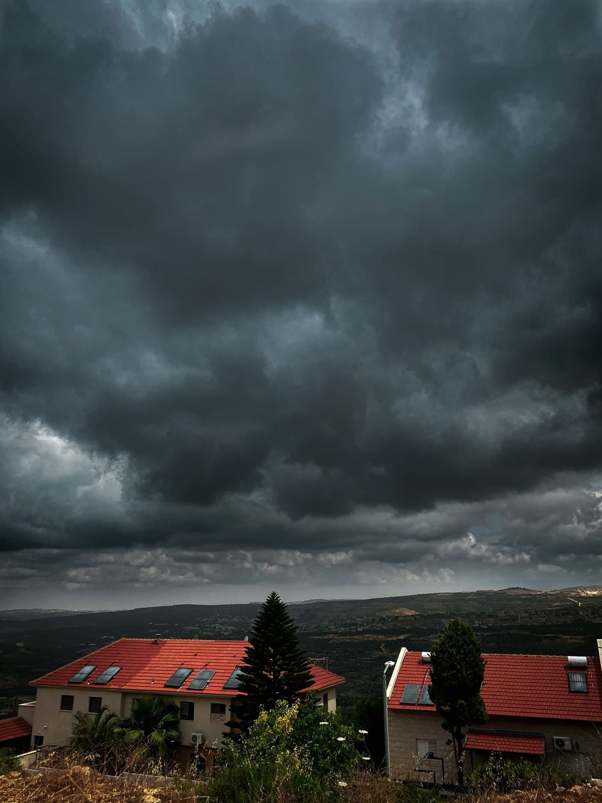 Storm clouds gathering over a South Florida neighborhood
